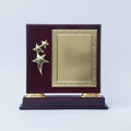 Decorative plaque with gold stars on a dark wood base