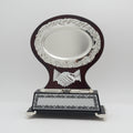 Decorative trophy with a handshake emblem on a wooden base