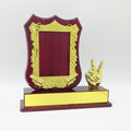 Decorative award with gold frame and peace sign on a red base, featuring product code and price.